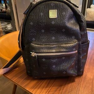 MCM Black Backpack with Gold Accents and Monogram Design